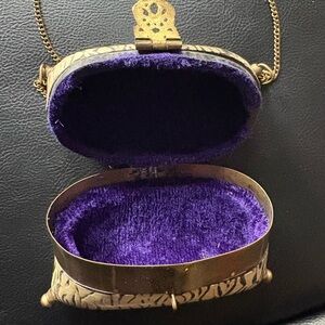 Elegant bone evening bag. Brass closure velvet lining